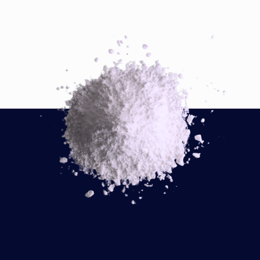 A mound of white powder centered on a split background, with the top half white and the bottom half dark navy blue.