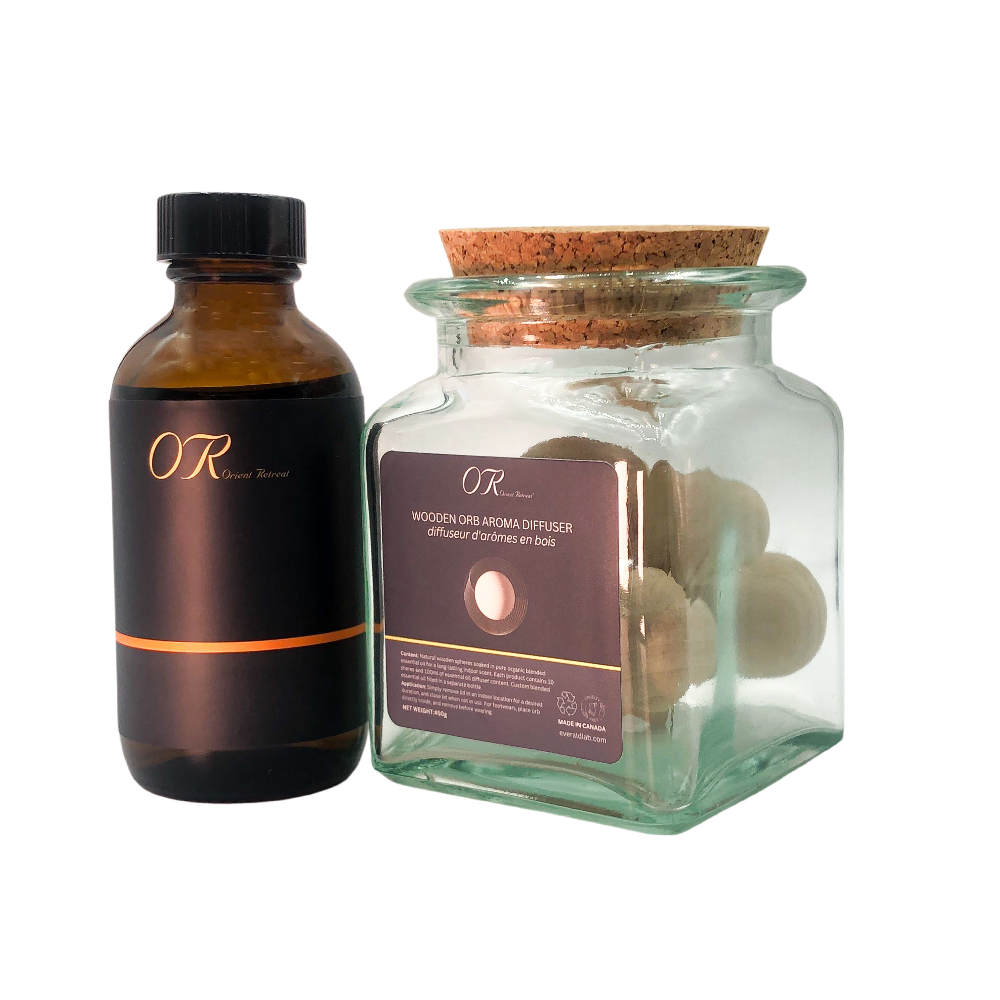 Brown bottle and glass jar with cork lid containing wooden balls on a white background