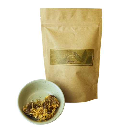 Organic marigold, calendula tea in bag and loose flowers. 