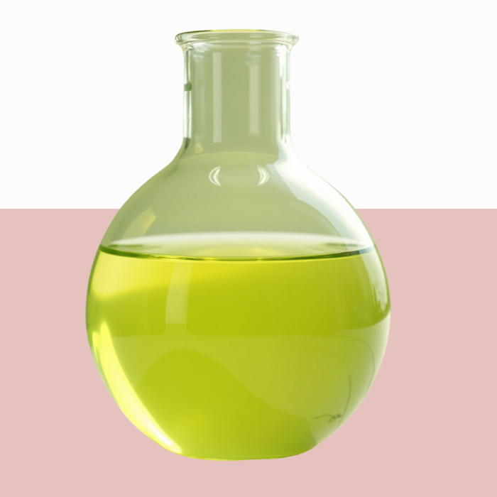 Round-bottom flask with organic jojoba oil.