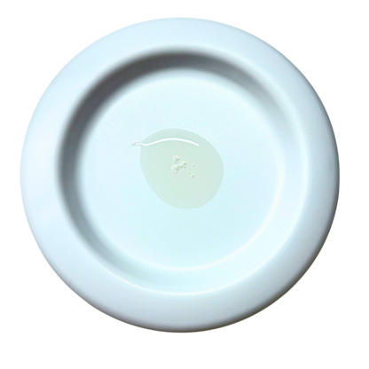 A round, shallow ceramic dish or saucer in a very pale icy blue color, photographed from directly above on a solid white background.